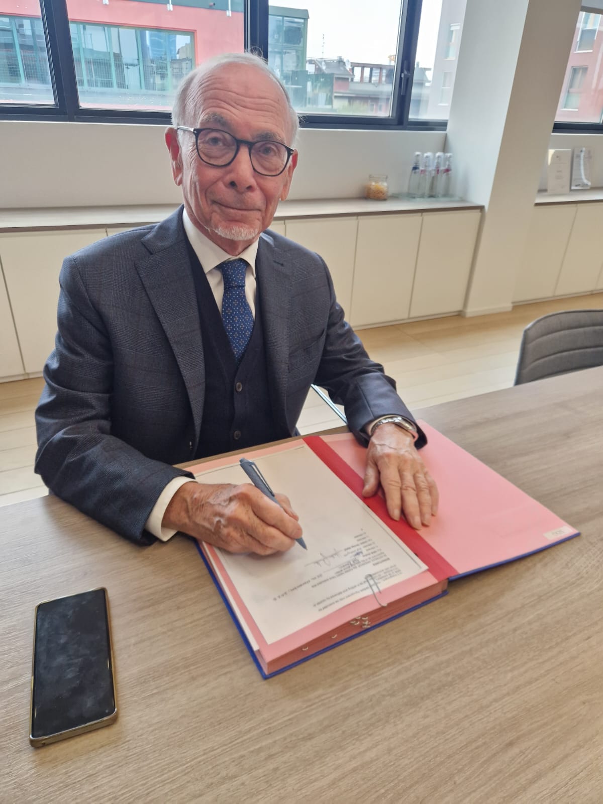 Unitec Group representative signing the agreement